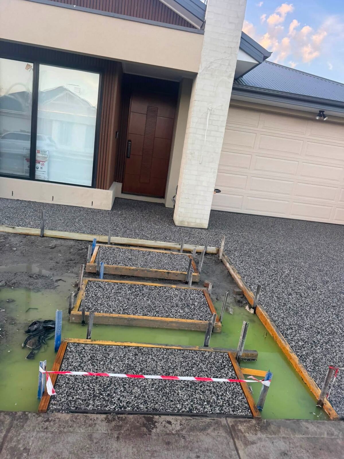 Exposed aggregate steps being formed up at a front entry